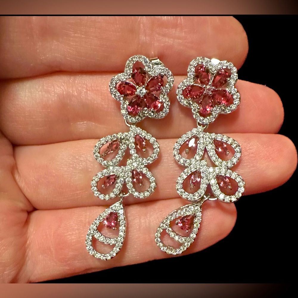 Floral Rhodolite cubic zirconia floral drop earrings.